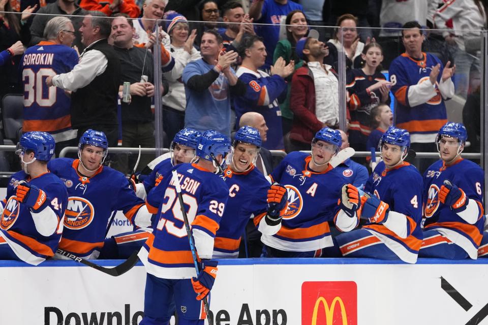 New York Islanders' Brock Nelson (29) is congratulated after scoring against the Montreal Canadiens during the second period of an NHL hockey game Wednesday, April 12, 2023, in Elmont, N.Y. (AP Photo/Frank Franklin II)