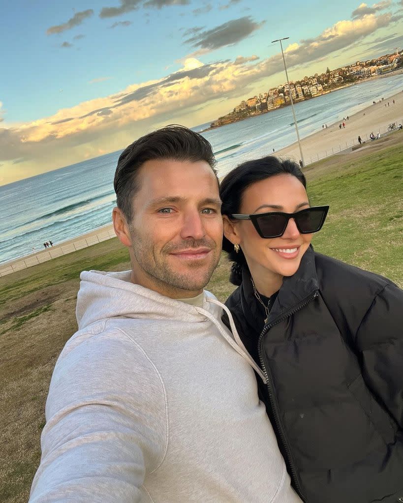 Mark and Michelle posing for a selfie at the beach