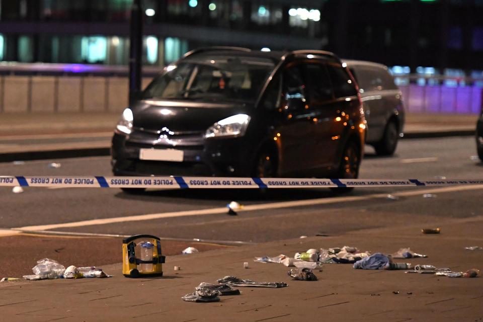 Debris and abandoned cars remain on London Bridge (Chris J Ratcliffe/AFP/Getty Images)