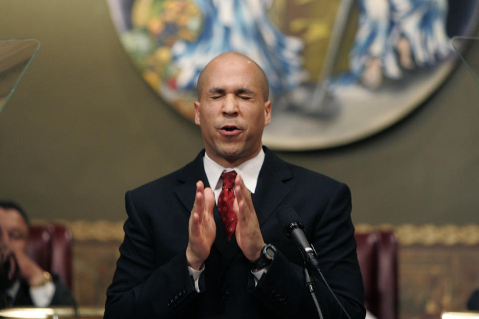 FILE - In this Feb. 8, 2007 file photo, then Newark Mayor Cory Booker gestures during his first State of the City address at City Hall in Newark, N.J. Months after Booker took office as mayor of Newark, N.J. in 2006, he enabled his law partner to take power at the nonprofit that supplied water to 500,000 state residents. During the ensuing seven years, allies of the two-term mayor wasted millions of dollars in public money at the Newark Watershed Conservation and Development Corporation. Booker says he was unaware of the corruption, which ultimately destroyed the nonprofit created to protect one of Newark’s most valuable assets. (AP Photo/Mike Derer)