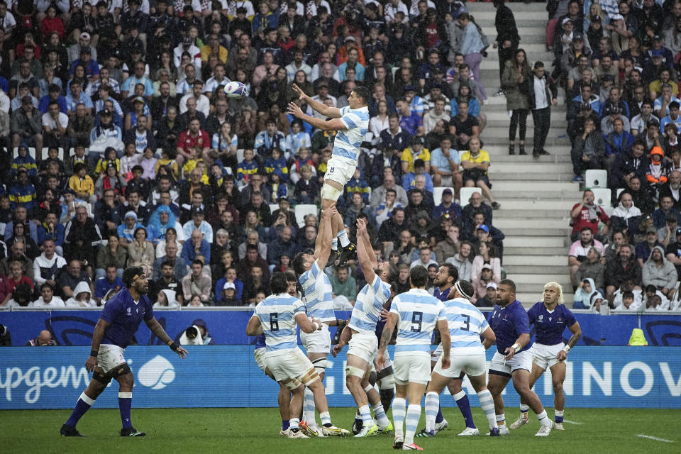 Argentina's Juan Martin Gonzalez, top, claims a line out during the Rugby World Cup Pool D match between Argentina and Samoa at the Stade Geoffroy Guichard in Saint-Etienne, France, Friday, Sept. 22, 2023. (AP Photo/Laurent Cipriani)