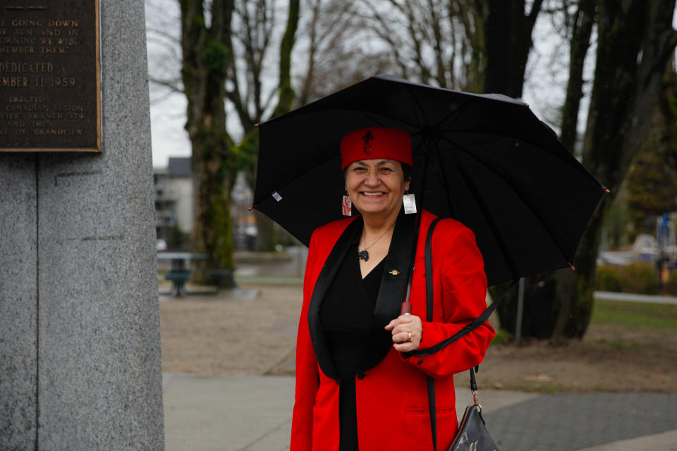 Joan Phillip stands next to the Grandview Park Cenotaph.