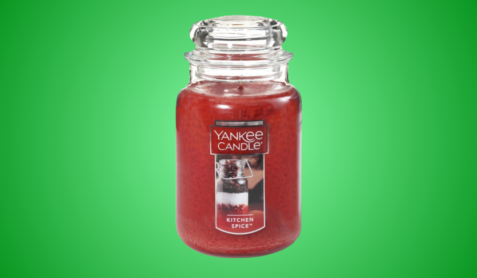 a red yankee candle in kitchen spice