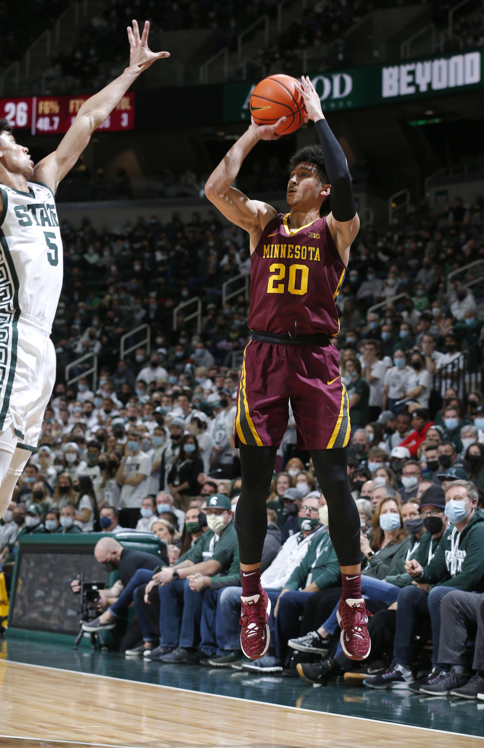 Minnesota's Eylijah Stephens, right, shoots against Michigan State's Max Christie (5) during the first half of an NCAA college basketball game, Wednesday, Jan. 12, 2022, in East Lansing, Mich. (AP Photo/Al Goldis)