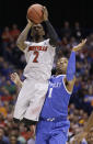 Louisville's Russ Smith (2) shoots past Kentucky's James Young (1) during the first half of an NCAA Midwest Regional semifinal college basketball tournament game Friday, March 28, 2014, in Indianapolis. (AP Photo/David J. Phillip)