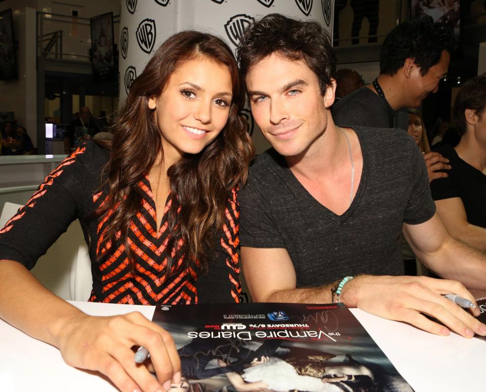 Nina Dobrev and Ian Somerhalder attends "The Vampire Diaries" signing in the Warner Bros. booth during Comic-Con 2013 on July 20, 2013 in San Diego, California