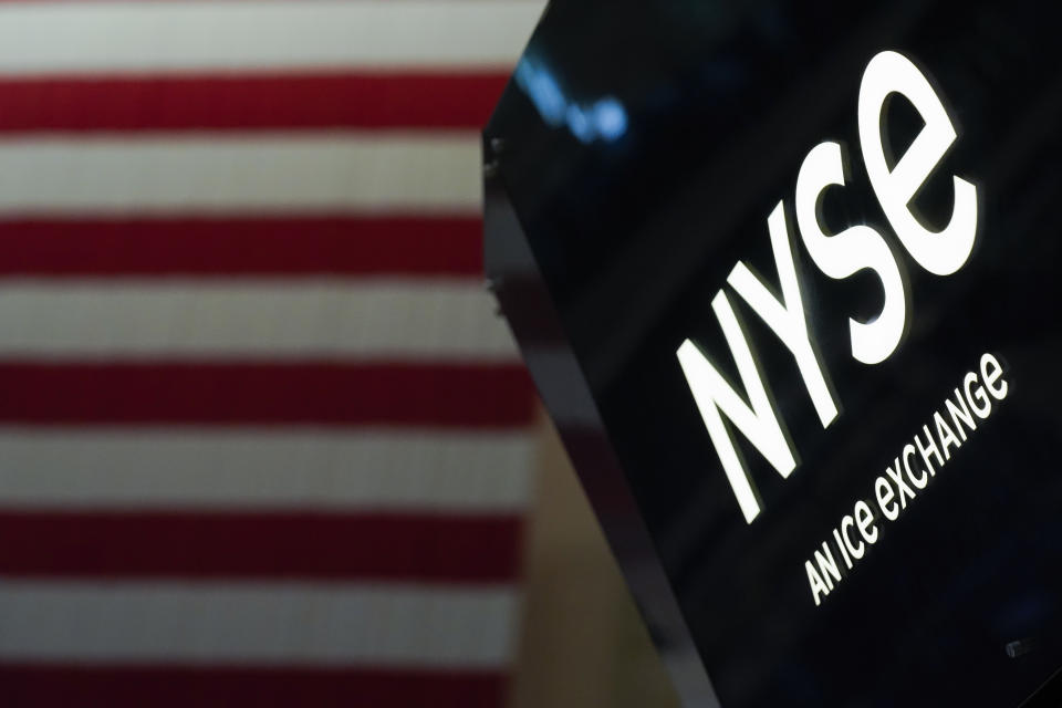 FILE - An NYSE sign is seen on the floor at the New York Stock Exchange in New York, Wednesday, June 15, 2022. (AP Photo/Seth Wenig, File)