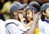 Kobe Bryant kisses his daughter, Gianna, after the Lakers defeated the Orlando Magic 99-86 in Game Five of the 2009 NBA Finals on June 14, 2009 at Amway Arena in Orlando, Florida. (Photo by Ronald Martinez/Getty Images)