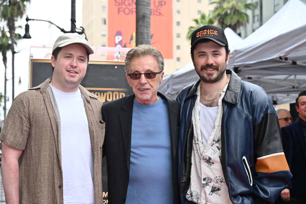 Frankie Valli between his twin sons Brando Valli (L) and Emilio Valli (R) at the Hollywood Walk of Fame Star ceremony for Frankie Valli & the Four Seasons on May 3, 2024.