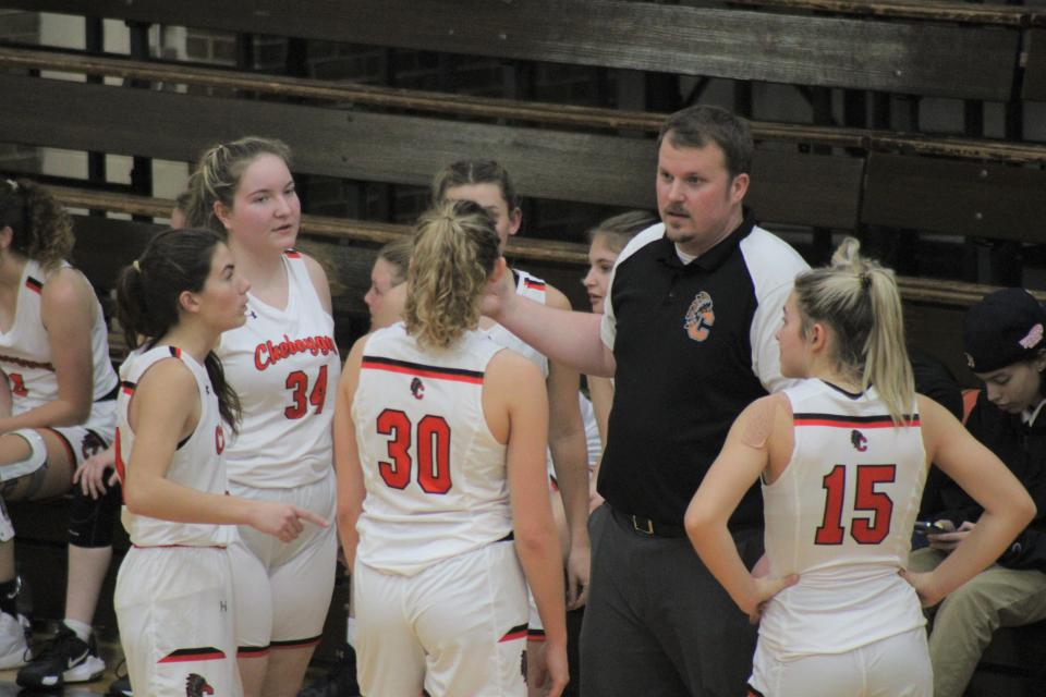 First-year Cheboygan varsity girls basketball coach Walter Hanson talks to players during a timeout on Thursday night.
