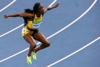 2016 Rio Olympics - Athletics - Final - Women's 100m Final - Olympic Stadium - Rio de Janeiro, Brazil - 13/08/2016. Elaine Thompson (JAM) of Jamaica celebrates after winning the race REUTERS/David Gray