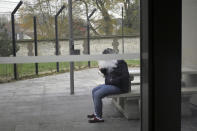 A patient smokes an electronic cigarette in the Rouvray psychiatric hospital, in Rouen, western France, Wednesday, Nov. 25, 2020. Lockdowns that France has used to fight the coronavirus have come at considerable cost to mental health. Surveying points to a surge of depression most acute among people without work, in financial hardship and young adults. (AP Photo/Thibault Camus)