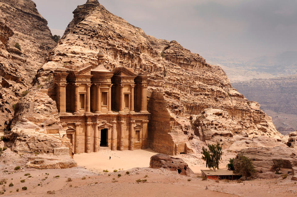 There is a person by the doorway to get a scale of the size.
A classic view of El Deir, The Monastery in Petra. Shown in the context of the mountain that the facade was carved out of by the Nabataeans in the 1st century. The facade measures 50 metres wide by approximately 45 meters high.