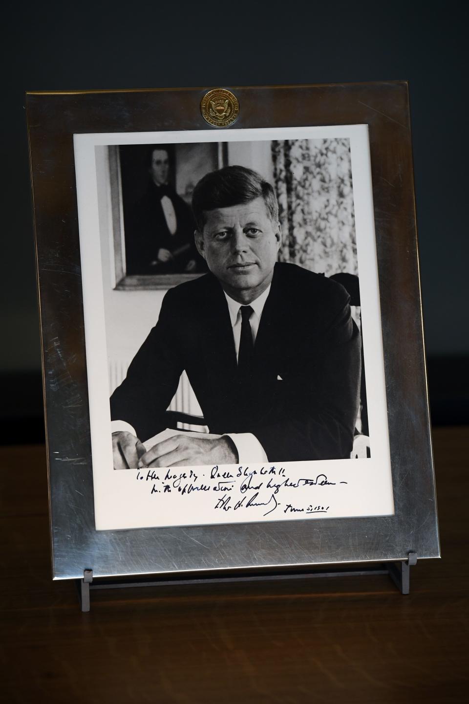 A photograph of President John F. Kennedy inscribed 'To Her Majesty Queen Elizabeth II, with appreciation and highest esteem, John F. Kennedy' in a Tiffany and Co. frame that was given to Queen Elizabeth II by John F. Kennedy at Buckingham Palace in 1961.