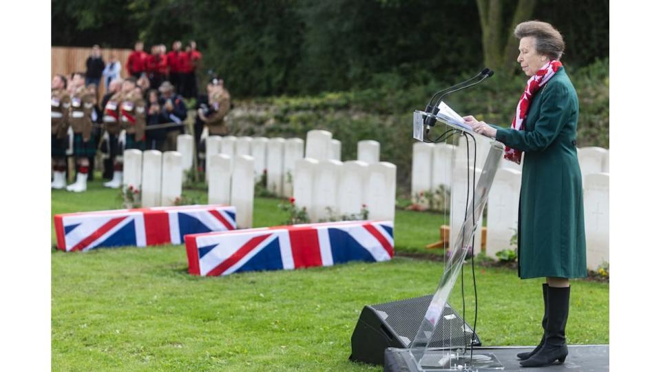 Britain's Princess Anne, Princess Royal reads a blessing as she attends the funeral of two unidentified Scottish soldiers who died during World War I, as they are buried at the Loos British Cemetery of the Commonwealth War Graves Commission (CWGC), in Loos-en-Gohelle, near Lens, northern France, on Septmber 26, 2024. Gun salutes rang out as two Scottish soldiers killed in World War I were reburied in northern France where Britain's Princess Anne opened an extended cemetery for the dead from the 1914-18 conflict still being found over a century on. The two unidentified men were buried among the perfectly aligned gravestones at Loos-en-Gohelle alongside 46 other unknown soldiers identified by the Commonwealth War Graves Commission (CWGC). (Photo by Sameer Al-DOUMY / AFP) (Photo by SAMEER AL-DOUMY/AFP via Getty Images)