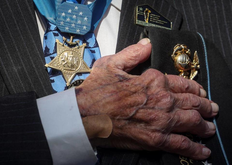 World War II veteran and recipient of the Medal of Honor Hershel Woodrow Williams puts his hand over his heart during the invocation at the National Medal of Honor Museum groundbreaking March 25.