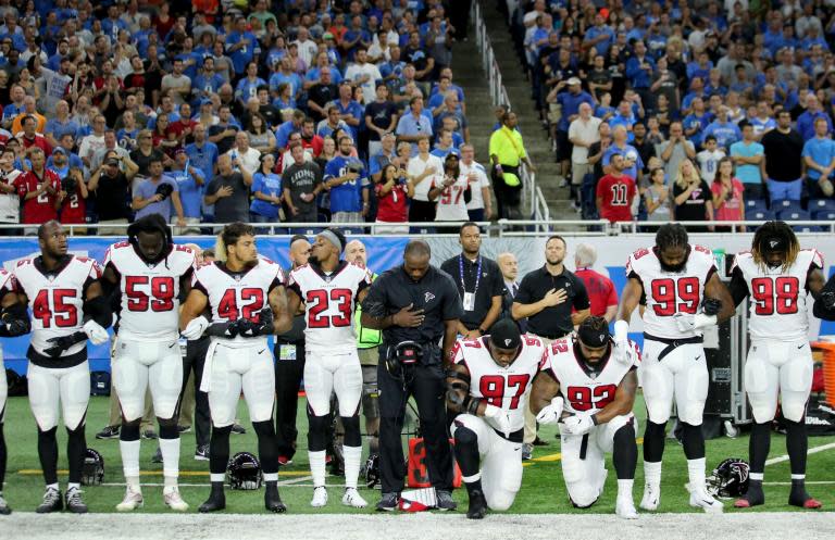 NFL protests: Pharrell, Stevie Wonder and John Legend 'take a knee' in solidarity against Donald Trump