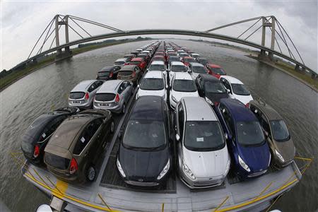 Newly manufactured Ford Fiesta cars are seen on the deck of the car transport ship "Tossa" as it travels along the Rhine, from a Ford plant in the German city of Cologne to the Dutch seaport of Vlissingen, close to Nimwegen in the Netherlands September 13, 2013. REUTERS/Wolfgang Rattay