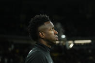 Brazil's Vinicius Jr walks onto the pitch for a friendly soccer match between Spain and Brazil at the Santiago Bernabeu stadium in Madrid, Spain, Tuesday, March 26, 2024. (AP Photo/Jose Breton)