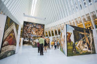 <p>Guests walk through the “Up Close: Michelangelo’s Sistine Chapel” re-creation exhibit at the Oculus at Westfield World Trade Center in New York. The exhibit features 34 reproductions, including “The Creation of Adam” and “The Last Judgement.” (AP Photo/Michael Noble Jr.) </p>