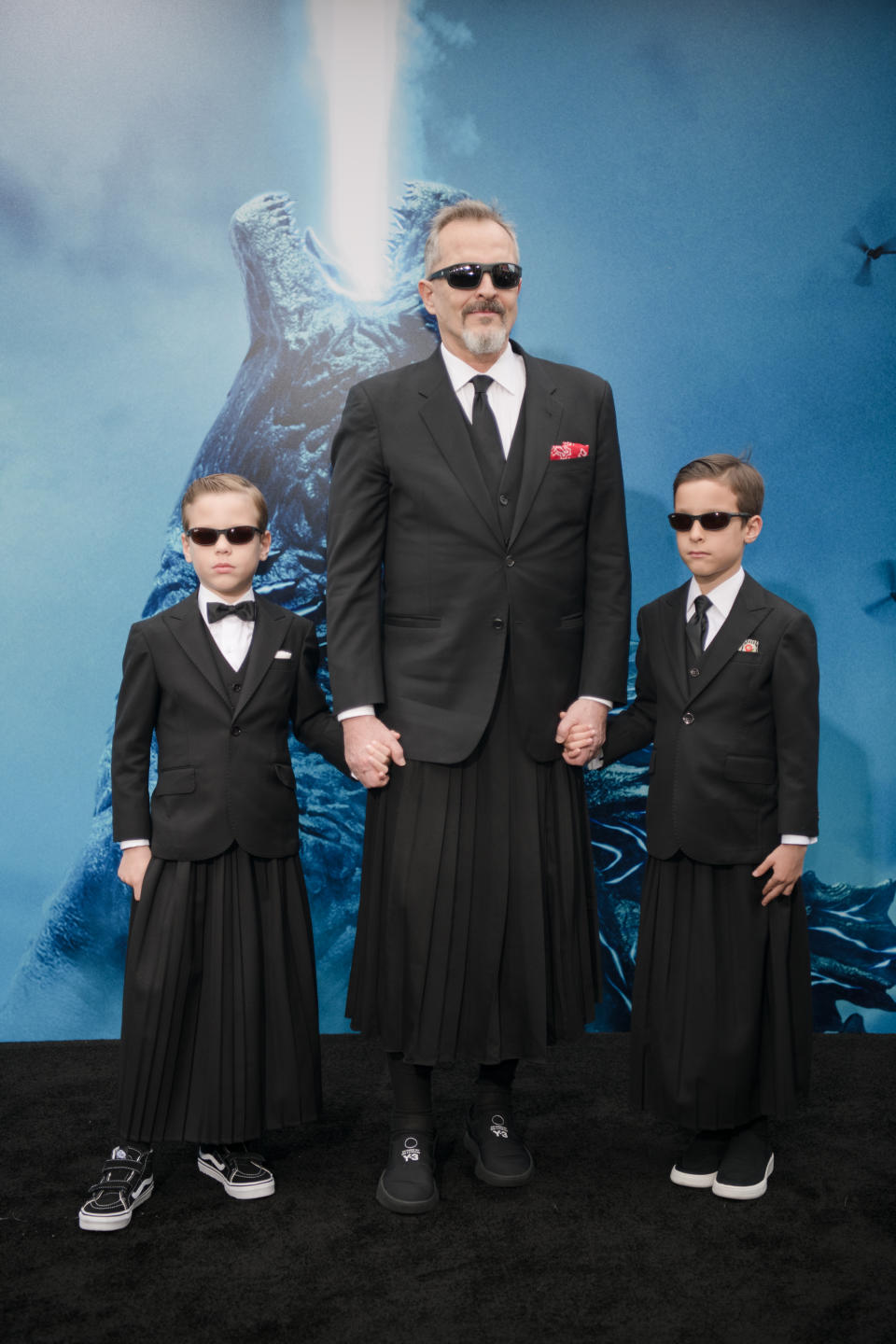 HOLLYWOOD, CALIFORNIA - MAY 18: Miguel Bose and sons Diego and Tadeo arrive at the premiere Of Warner Bros. Pictures And Legendary Pictures' "Godzilla: King Of The Monsters" at TCL Chinese Theatre on May 18, 2019 in Hollywood, California. (Photo by Morgan Lieberman/WireImage)