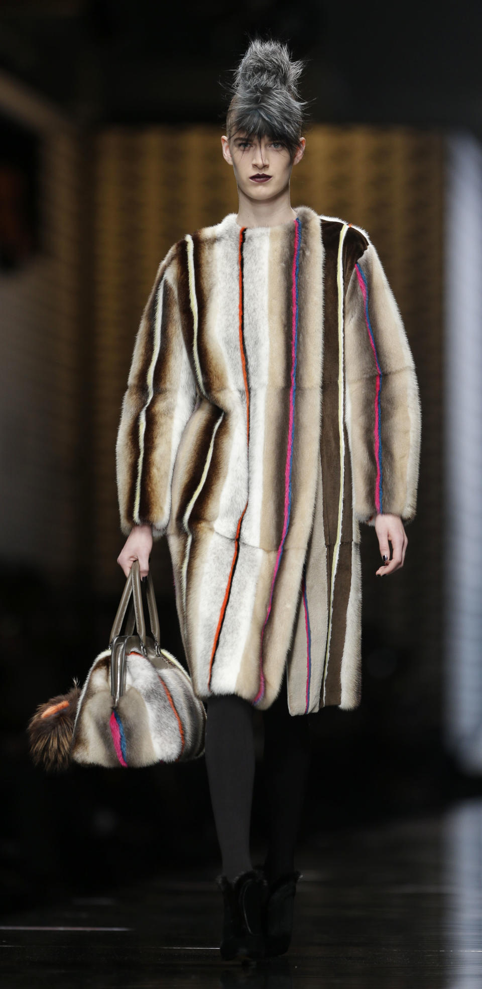 A model wears a creation of Fendi women's Fall-Winter 2013-14 collection, part of the Milan Fashion Week, unveiled in Milan, Italy, Thursday, Feb. 21, 2013. (AP Photo/Luca Bruno)