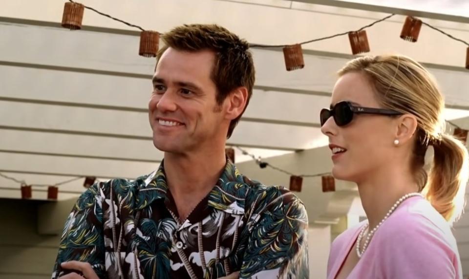 Jim Carrey and Tea Leoni as Dick and Jane speaking to their neighbors