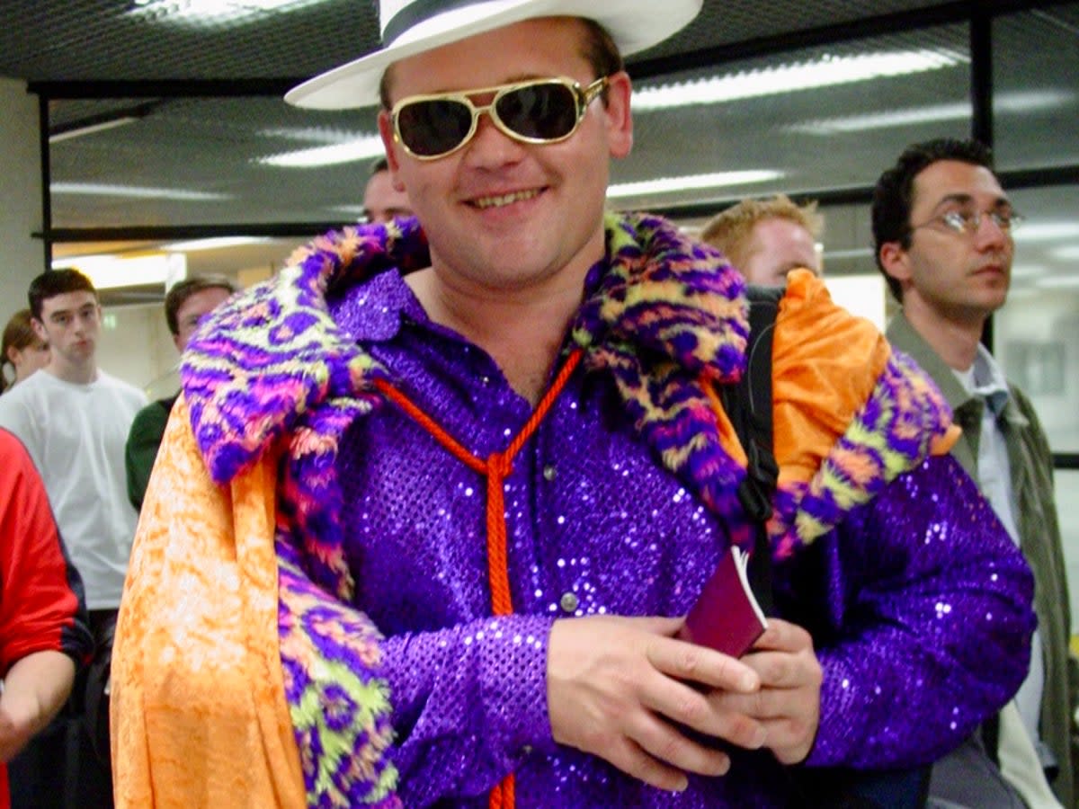 Lonesome tonight? Elvis impersonator in the passport queue at Amsterdam Schiphol airport (Simon Calder)