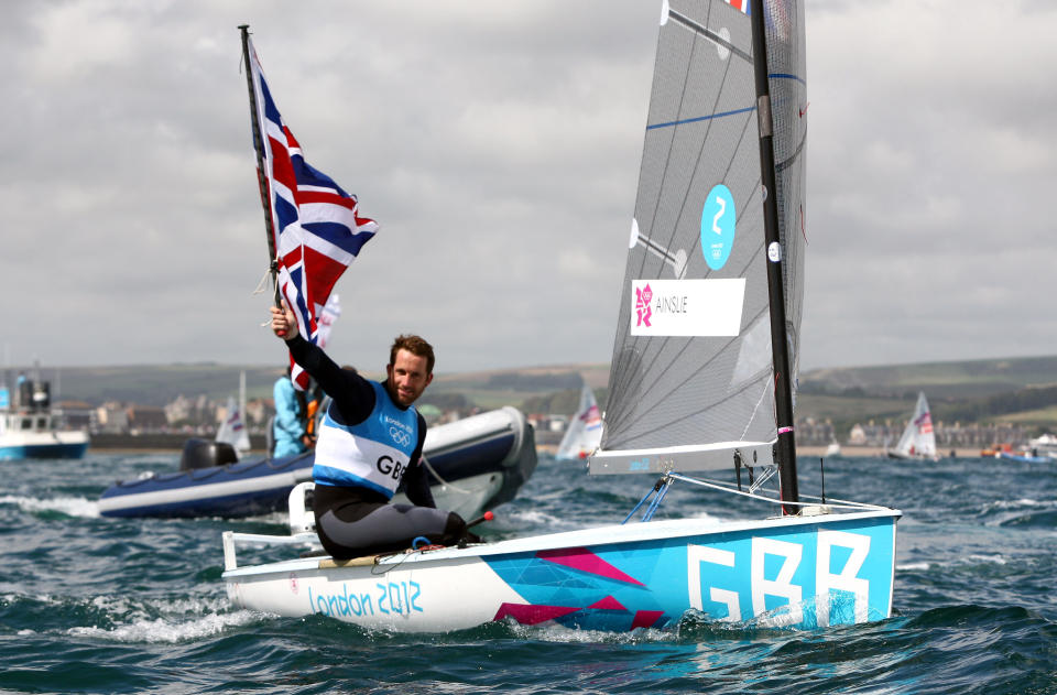 Great Britain's Ben Ainslie celebrates winning the Gold Medal after the Men's Finn Medal Race in Weymouth, during day nine of the London 2012 Olympics.