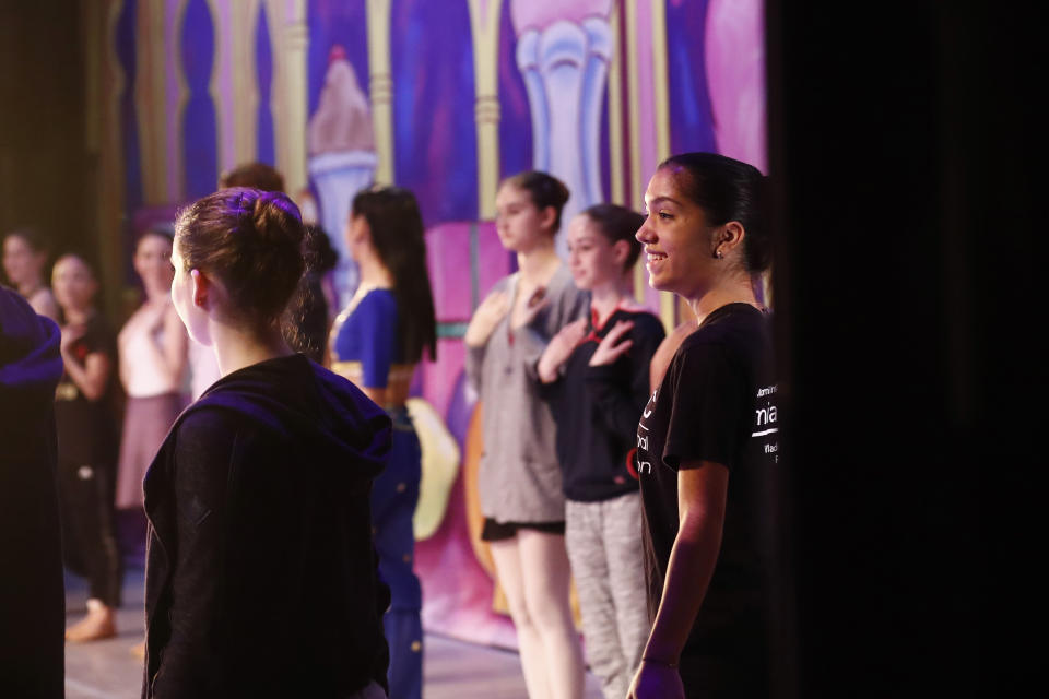 Paola Nava, 17, laughs on stage during a rehearsal of Vladimir Issaev's rendition of The Nutcracker ballet on Friday, Dec. 13, 2019, in Fort Lauderdale, Fla. More than 20 dancers of Venezuelan origin were playing various roles on a recent performance of the holiday favorite “The Nutcracker.” Some of these dancers are here seeking asylum after fleeing their crisis-torn nation, which is plagued by shortages of food and medicine. (AP Photo/Brynn Anderson)