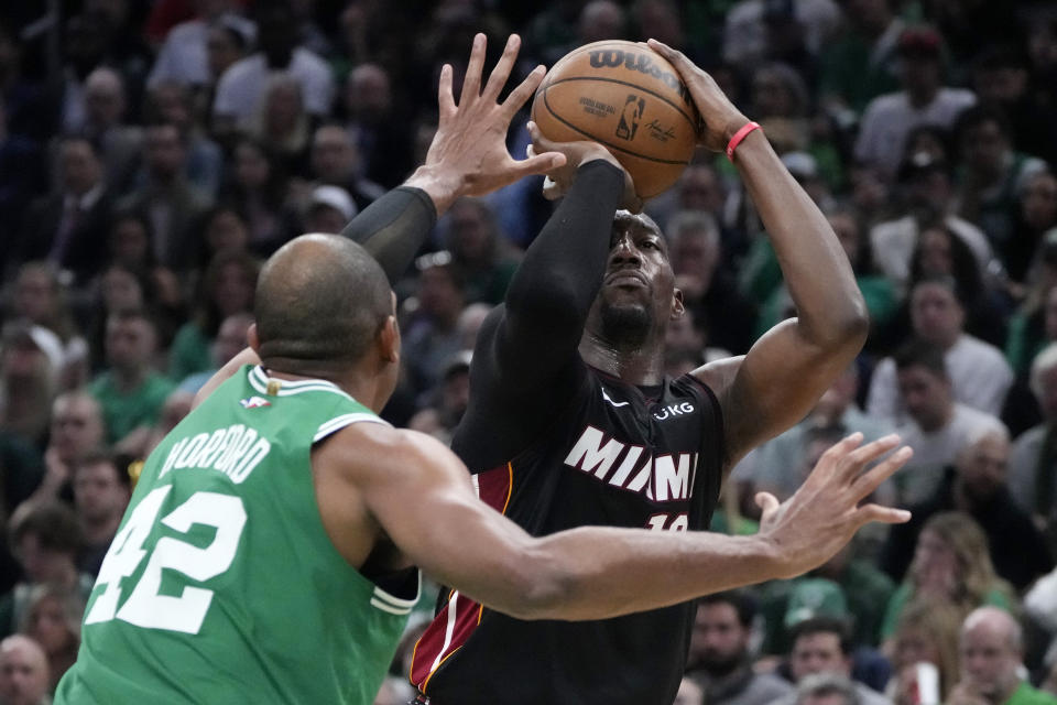 Miami Heat center Bam Adebayo, right, shoots as Boston Celtics center Al Horford defends during the second half in Game 7 of the NBA basketball Eastern Conference finals Monday, May 29, 2023, in Boston. (AP Photo/Charles Krupa )