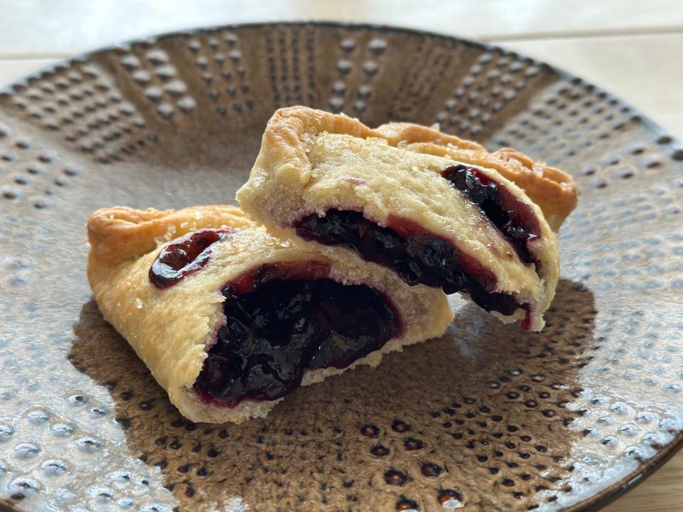 blueberry lemon pie broken in half