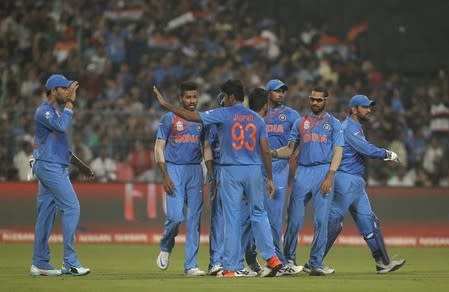 Cricket - India v Pakistan- World Twenty20 cricket tournament - Kolkata, 19/03/2016. Jasprit Bumrah (C) celebrates with his teammates after taking the wicket of Pakistan's Ahmed Shehzad. REUTERS/Rupak De Chowdhuri