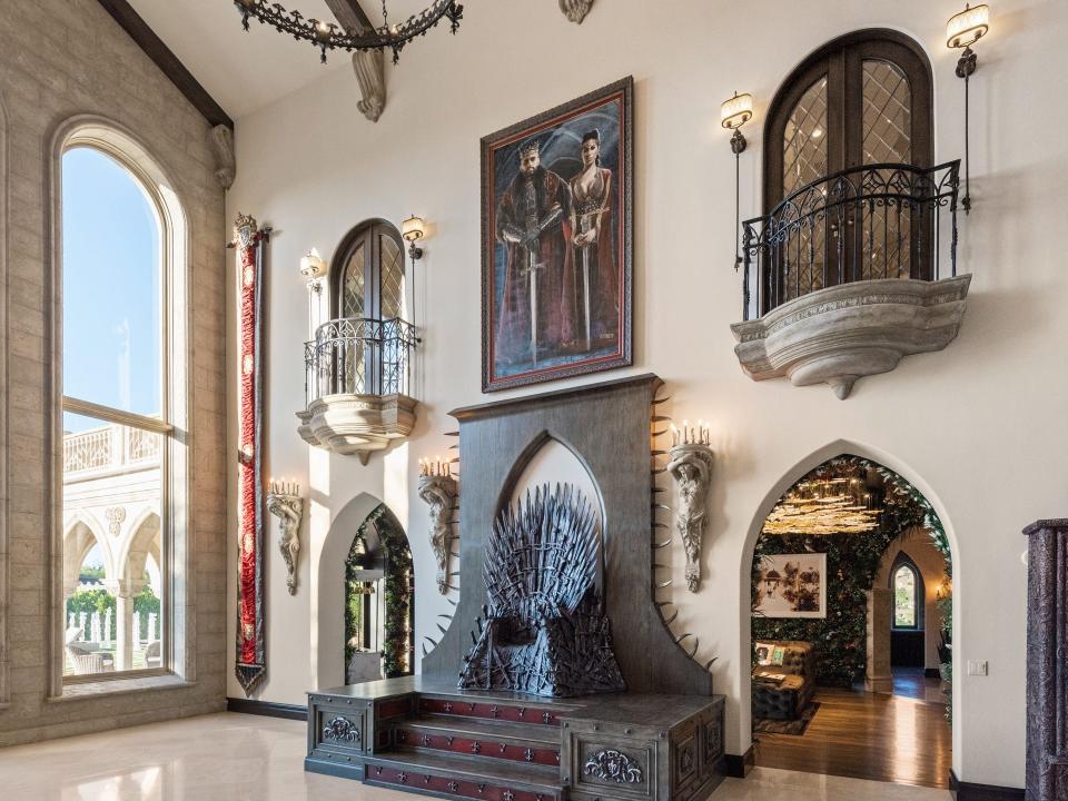 The living room has a replica of the iron throne from the television show "Game of Thrones."