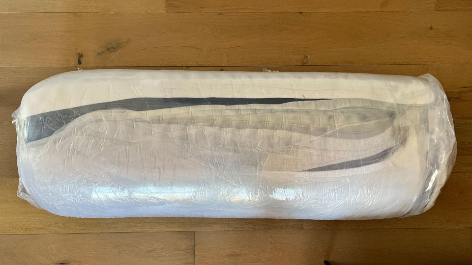 Helix Midnight mattress rolled up in its packaging