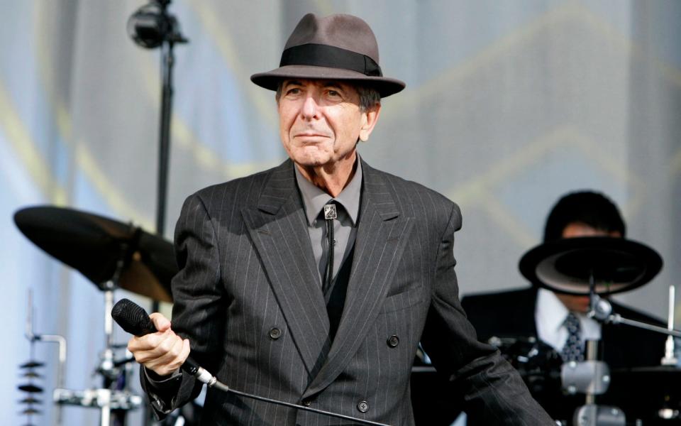 Leonard Cohen performing on the Pyramid stage at Glastonbury in 2008 - Clara Molden