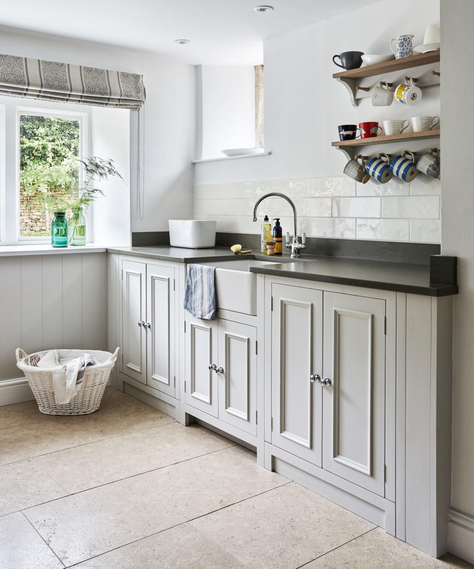 laundry room with cabinets and shelf