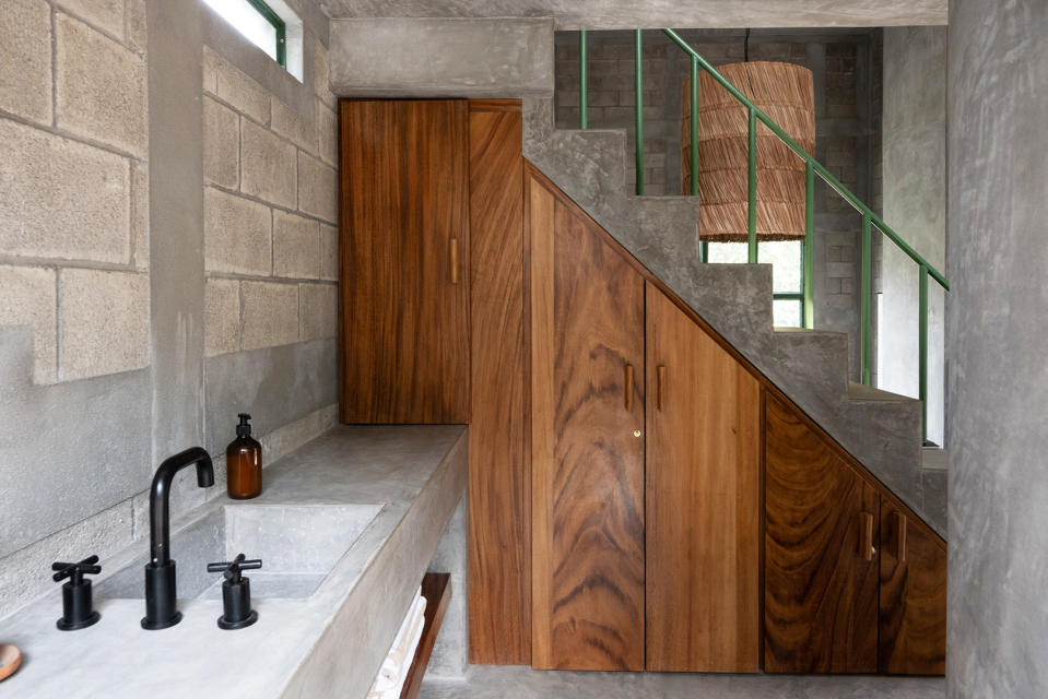 Basement bathroom sink next to staircase