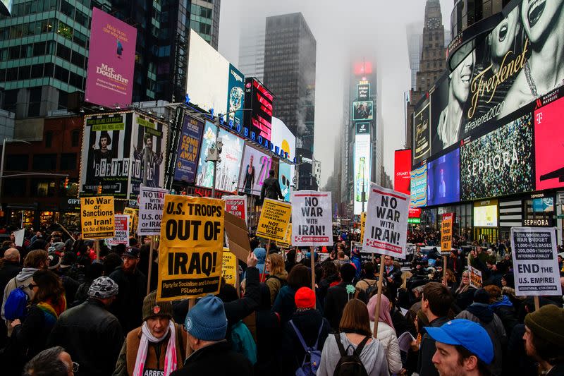 People take part in an anti-war protest amid increased tensions between the United States and Iran at Times Square in New York