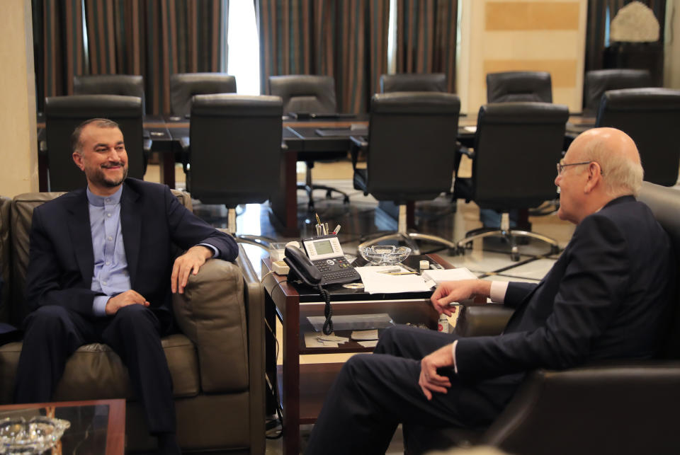 Iranian Foreign Minister Hossein Amirabdollahian, left, meets with Lebanese Prime Minister Najib Mikati, at the government house, in Beirut, Lebanon, Thursday, Oct. 7, 2021. Amirabdollahian is in Beirut to meet with Lebanese officials. (AP Photo/Hussein Malla)