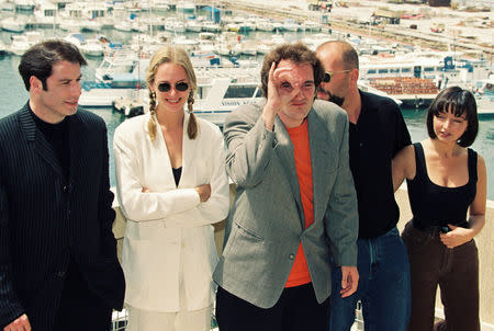 Actor John Travolta, actress Uma Thurman, director Quentin Tarantino, actor Bruce Willis and actress Maria de Medeiros pose during a photocall for their film "Pulp Fiction" in competition at the 47th Cannes Film Festival in Cannes, France, May 21, 1994. REUTERS/Eric Gaillard/File Photo
