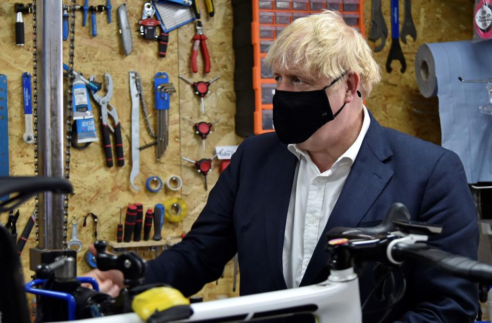 Boris Johnson wears during a visit to a bicycle repair shop in Beeston, central England last week. (Getty)