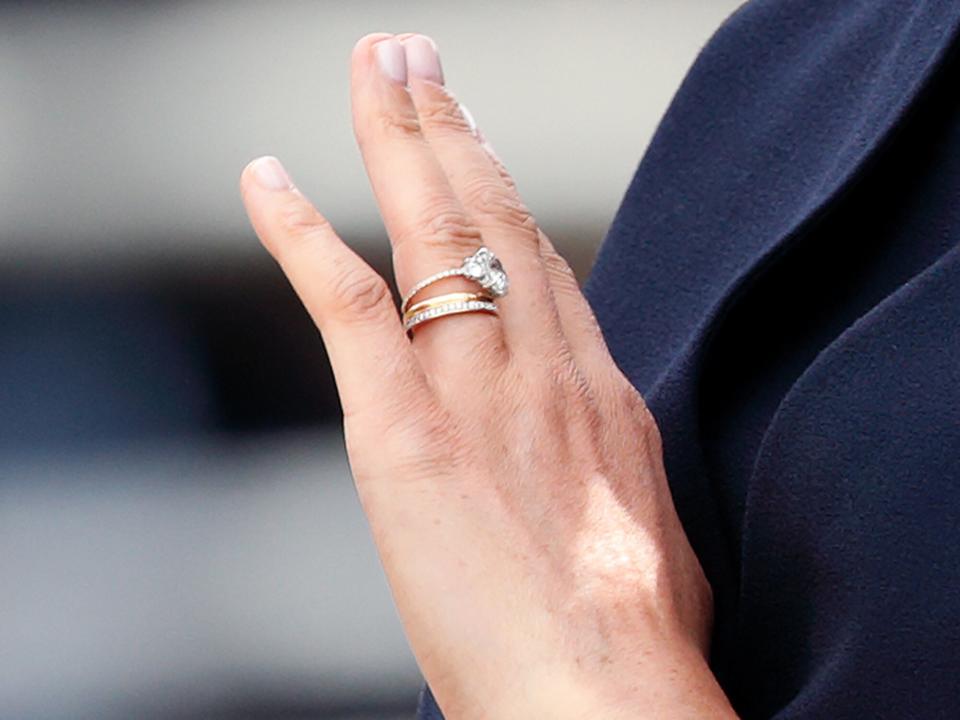 Meghan, Duchess of Sussex (ring detail) travels down The Mall in a horse drawn carriage during Trooping The Colour, the Queen's annual birthday parade, on June 8, 2019 in London, England. The annual ceremony involving over 1400 guardsmen and cavalry, is believed to have first been performed during the reign of King Charles II. The parade marks the official birthday of the Sovereign, although the Queen's actual birthday is on April 21st