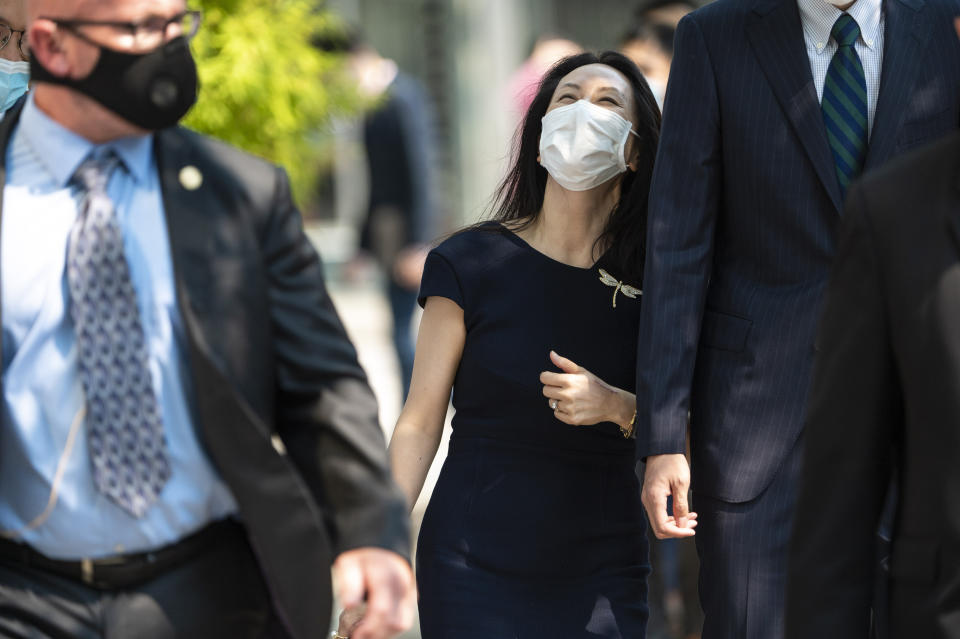 Meng Wanzhou, chief financial officer of Huawei, leaves for a lunch break during her extradition hearing at British Columbia Supreme Court Friday, Aug. 13, 2021 in Vancouver, British Columbia. (Jimmy Jeong/The Canadian Press via AP)