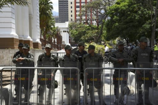 Bolivarian National Guard personnel positioned outside the Venezuela's opposition-controlled National Assembly building in Caracas