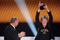 ZURICH, SWITZERLAND - JANUARY 07: Pia Sudhage, women's coach of United States receives the FIFA World Coach of Women's Football 2012 trophy by Felipe Scolari (L) at Congress House on January 7, 2013 in Zurich, Switzerland. (Photo by Christof Koepsel/Getty Images)