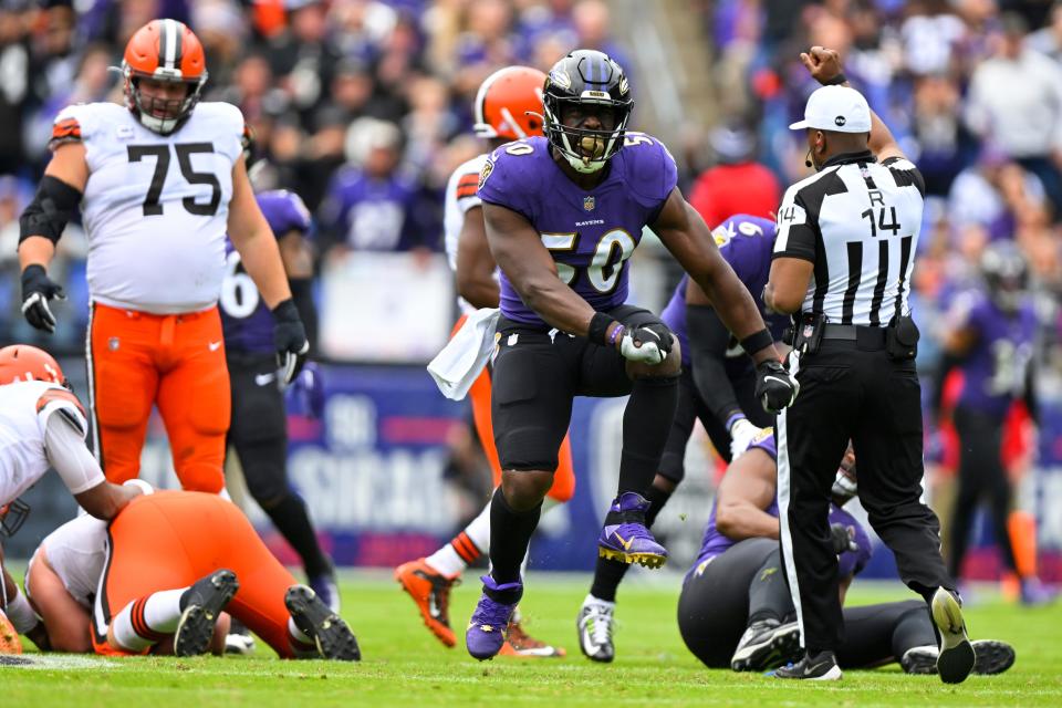 Baltimore Ravens linebacker Justin Houston (50) celebrates after sacking Cleveland Browns quarterback Jacoby Brissett during the first half of a NFL football game, Sunday, Oct. 23, 2022, in Baltimore. (AP Photo/Terrance Williams)