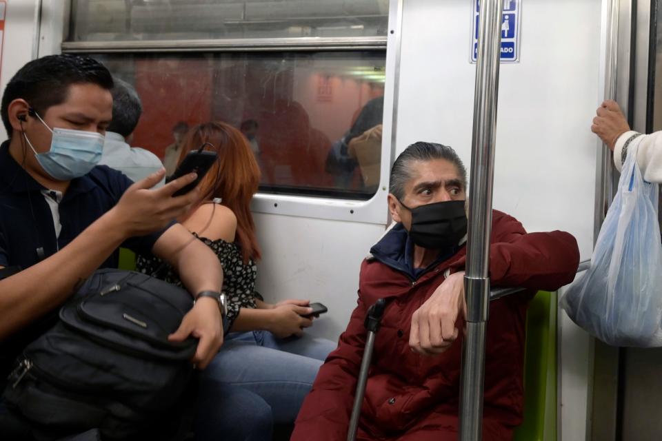 Commuters wearing facemasks ride the metro in Mexico City, on December 4, 2020 amid the COVID-19 coronavirus pandemic. (Photo by ALFREDO ESTRELLA / AFP) (Photo by ALFREDO ESTRELLA/AFP via Getty Images)