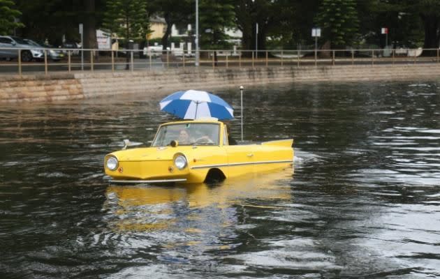 Not even the gloomy weather could ruin the fun of taking this vintage amphicar out for a spin. Source: Be