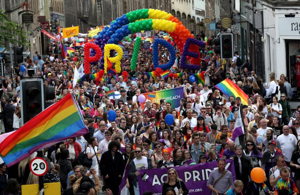 Pride marchers in the Royal Mile in Edinburgh (Andrew Milligan/PA) (PA Archive)